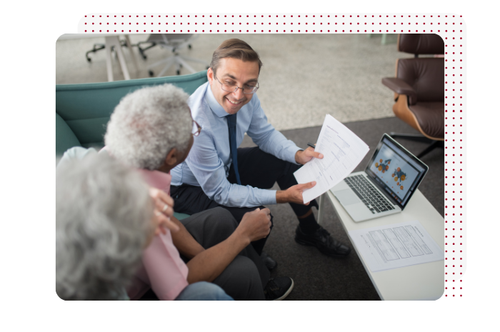 Picture of man showing documents to couple with red dot background