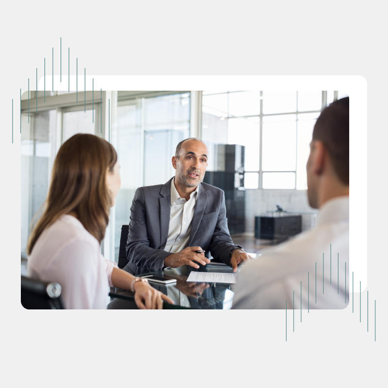 Man talking to man and woman in office Man talking to man and woman in office